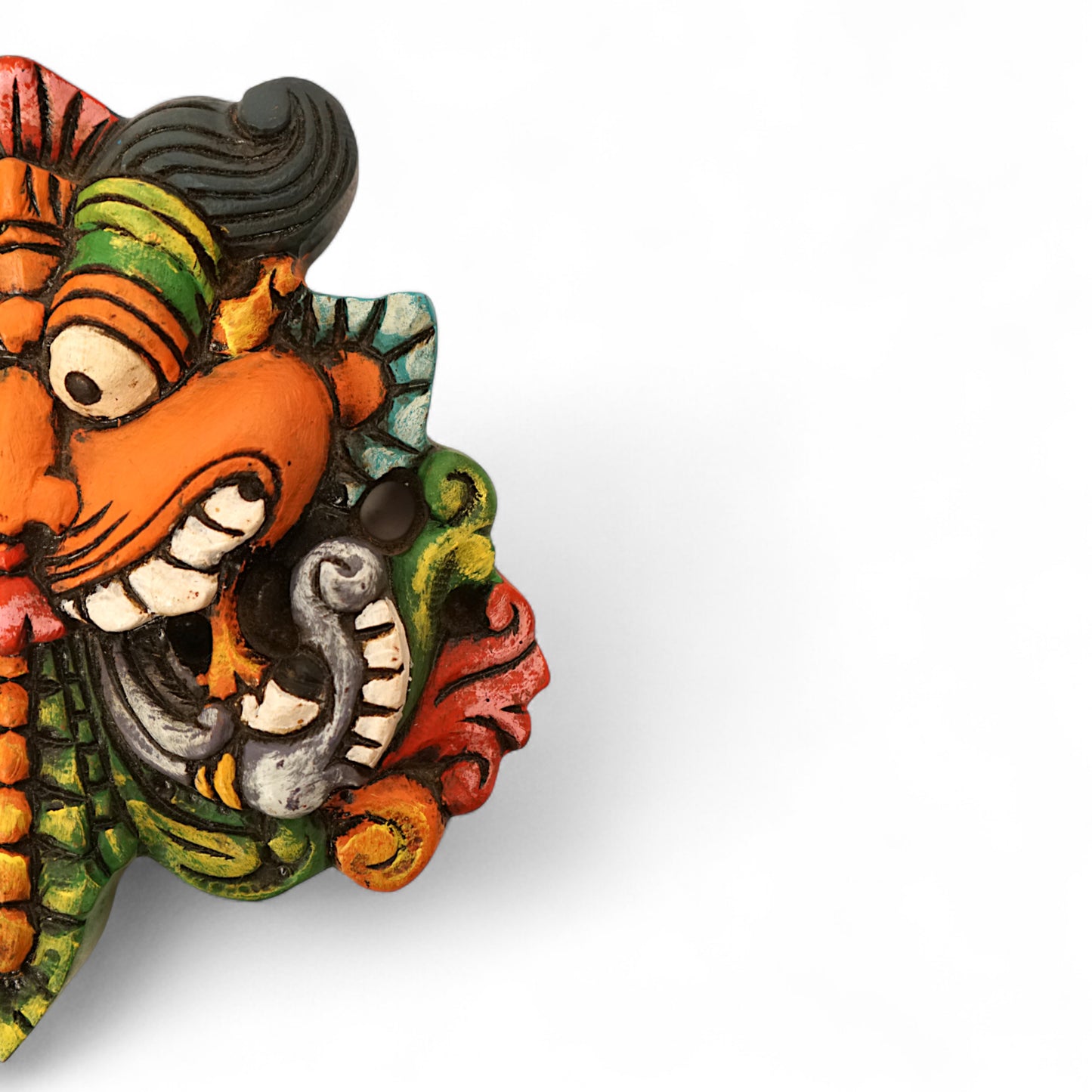 Hand-carved and hand-painted Yaali face wooden wall mount decor