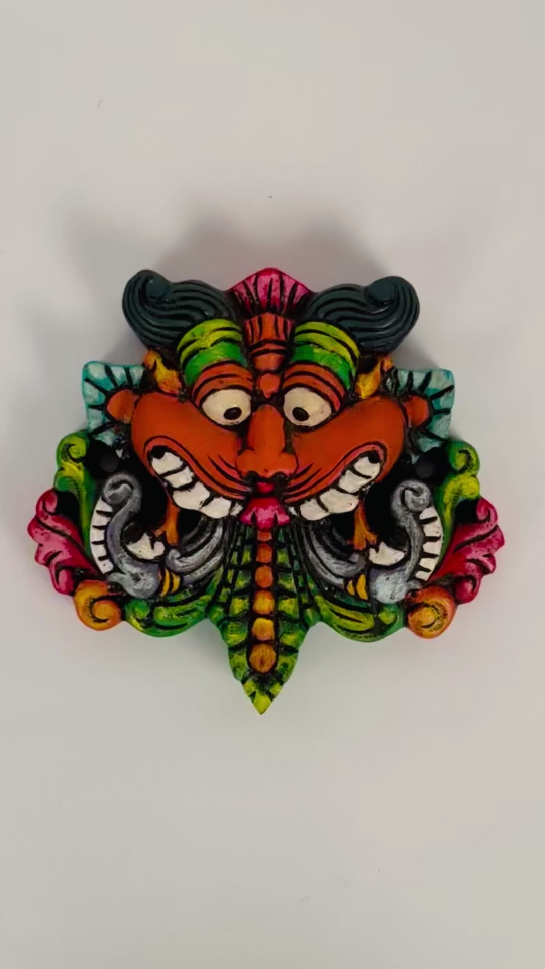Hand-carved and hand-painted Yaali face wooden wall mount decor